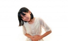 Stomach ache on a girl with worm damage