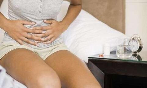 pain in the abdomen of women caused by the presence of parasites